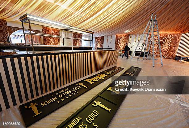 Workers continue to build the tent for the 19th Annual Screen Actor Guild Awards after party during behind the scenes event at The Shrine Auditorium...