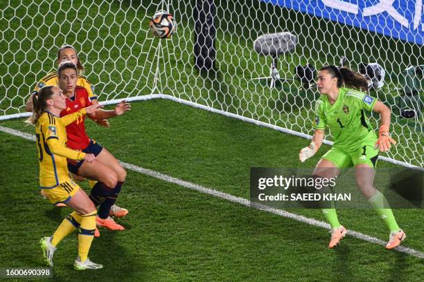 Sweden's defender Amanda Ilestedt prepares to defend the ball past her teammate goalkeeper Zecira Musovic during the Australia and New Zealand 2023...