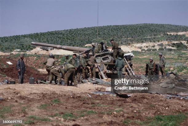 Israeli troops firing a round from a 175mm self-propelled gun toward Palestinian positions on the third day of Israel's invasion of southern Lebanon,...