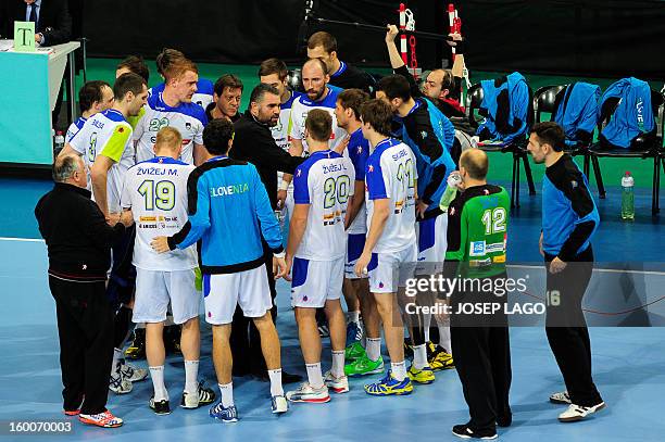 Slovenian national handball team's players listen to their coach during a time-out of the 23rd Men's Handball World Championships semifinal match...