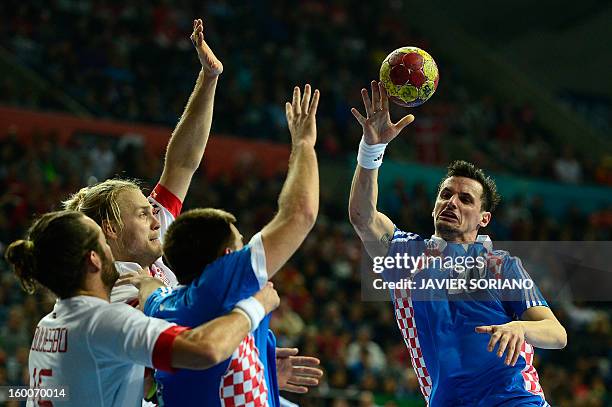 Croatia's Ivan Nincevic vies for the ball during the 23rd Men's Handball World Championships semifinal match Spain vs Slovenia at the Palau Sant...