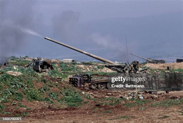 Israeli troops firing a round from a 175mm self-propelled gun toward Palestinian positions on the third day of Israel's invasion of southern Lebanon,...