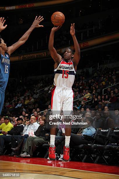 Jordan Crawford of the Washington Wizards shoots against Mickael Gelabale of the Minnesota Timberwolves during the game at the Verizon Center on...