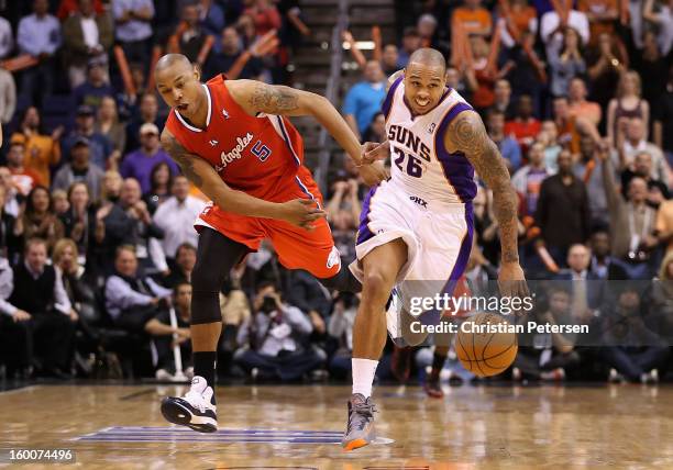 Shannon Brown of the Phoenix Suns is fouled by Caron Butler of the Los Angeles Clippers as he moves the ball upcourt during the NBA game at US...