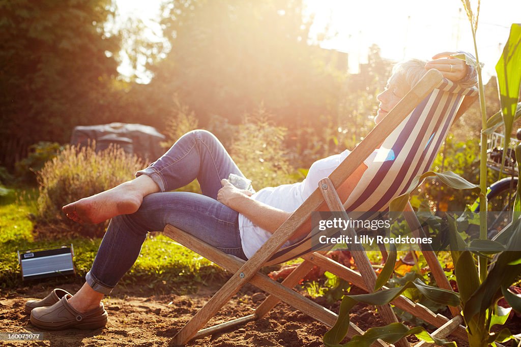 Woman relaxing on allotment