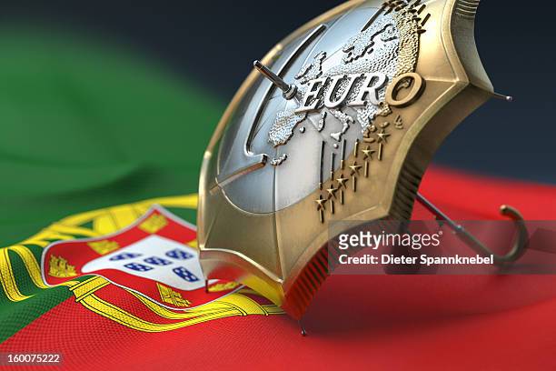 euro coin designed umbrella on a flag of portugal - 欧州金融安定ファシリティ ストックフォトと画像
