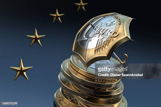euro coin designed umbrella on a stack of coins - 欧州金融安定ファシリティ ストックフォトと画像