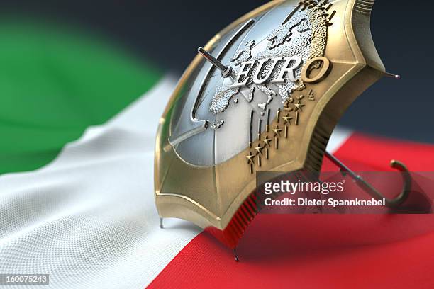 euro coin designed umbrella on a flag of italy - 欧州金融安定ファシリティ ストックフォトと画像