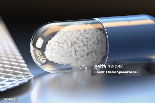 medicament capsule with white brain inside - alzheimers brain stock illustrations