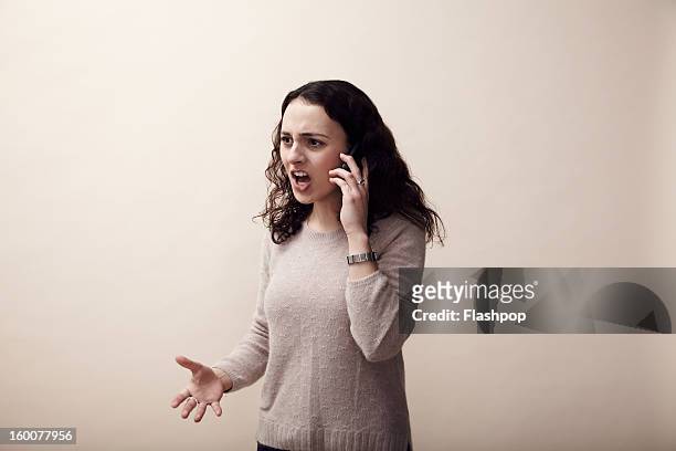woman using phone - shouting phone stock pictures, royalty-free photos & images