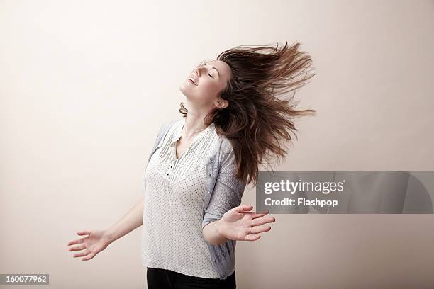 portrait of carefree woman - tousled hair stock pictures, royalty-free photos & images