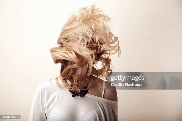 portrait of woman feeling carefree - tousled hair stock pictures, royalty-free photos & images