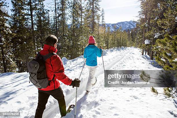 a family snowshoeing in the winter. - sun valley idaho stock-fotos und bilder