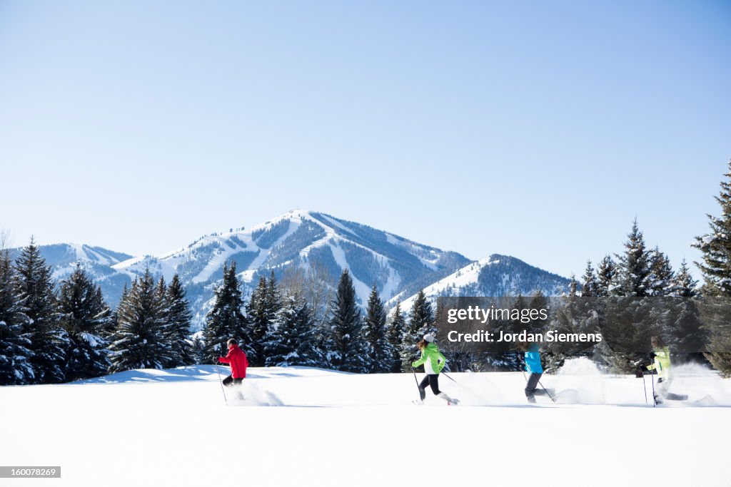 A family snowshoeing in the Winter.