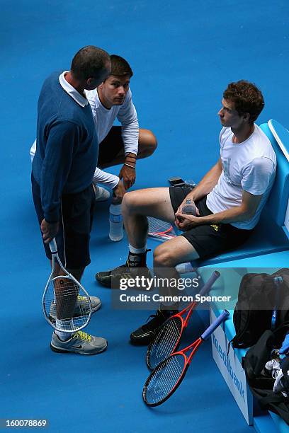 Andy Murray of Great Britain talks to his coach Ivan Lendl with Daniel Vallverdu and Jez Green, in a practice session during day thirteen of the 2013...