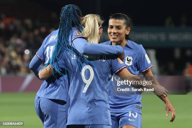 Eugenie Le Sommer of France celebrates with teammates Kadidiatou Diani and Kenza Dali after scoring her team's fourth goal during the FIFA Women's...