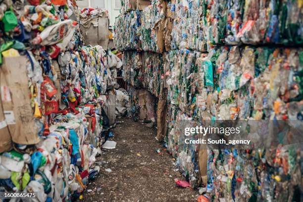 recycling centre with plastic garbage piles ready to recycle - bottle bank stock pictures, royalty-free photos & images