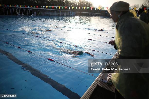 Competitors take part in the UK Cold Water Swimming Championships at Tooting Bec Lido on January 26, 2013 in London, England. Open to all comers the...