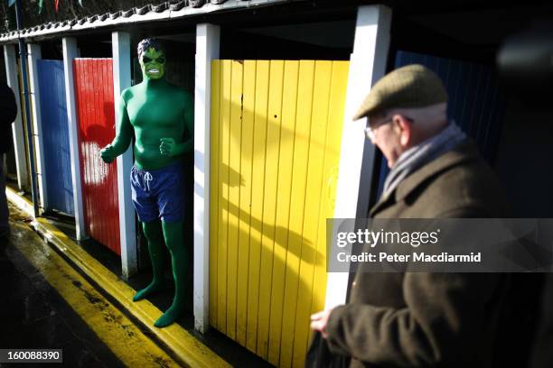 Competitor dresses as The Hulk as he takes part in the UK Cold Water Swimming Championships at Tooting Bec Lido on January 26, 2013 in London,...