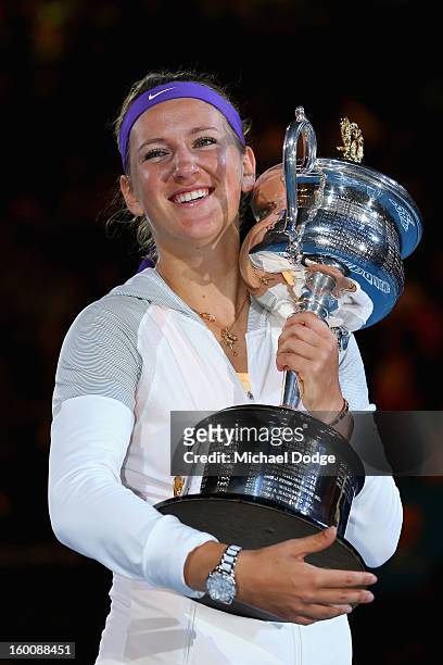 Victoria Azarenka of Belarus poses with the Daphne Akhurst Memorial Cup after winning her women's final match against Na Li of Chinaduring day...