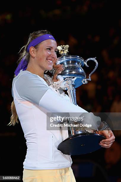 Victoria Azarenka of Belarus poses with the Daphne Akhurst Memorial Cup after winning her women's final match against Na Li of Chinaduring day...