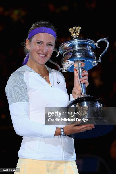 Victoria Azarenka of Belarus poses with the Daphne Akhurst Memorial Cup after winning her women's final match against Na Li of Chinaduring day...