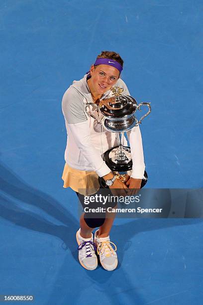 Victoria Azarenka of Belarus poses with the Daphne Akhurst Memorial Cup after winning her women's final match against Na Li of Chinaduring day...