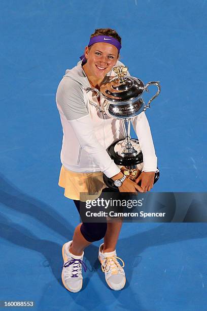 Victoria Azarenka of Belarus poses with the Daphne Akhurst Memorial Cup after winning her women's final match against Na Li of Chinaduring day...