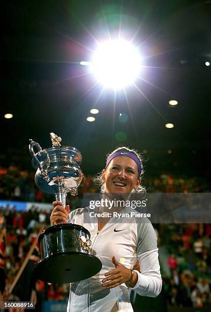 Victoria Azarenka of Belarus poses with the Daphne Akhurst Memorial Cup after winning her women's final match against Na Li of China during day...