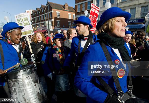 Nurses who took part in the London 2012 Olympic opening ceremony wear their costumes as they join demonstrators in South-East London on January 26,...