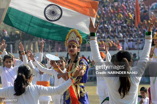 Indian schoolchildren perform during a ceremony to celebrate India's 64th Republic Day parade at The Guru Nanak Stadium in Amritsar on January 26,...