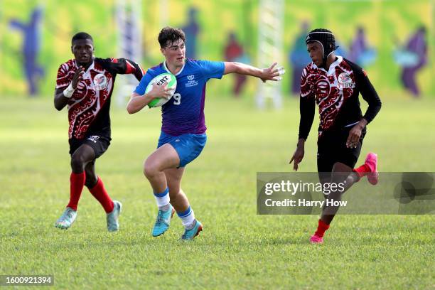 Hugo Shields England Rugby Hugo Alderson of Scotland runs ahead of Elijah Williams and Xavier ...
