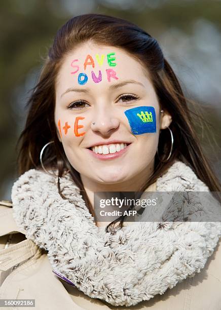 Woman wears face paintduring a demonstration in South-East London on January 26, 2013 to protest against the proposed closure of the Accident and...