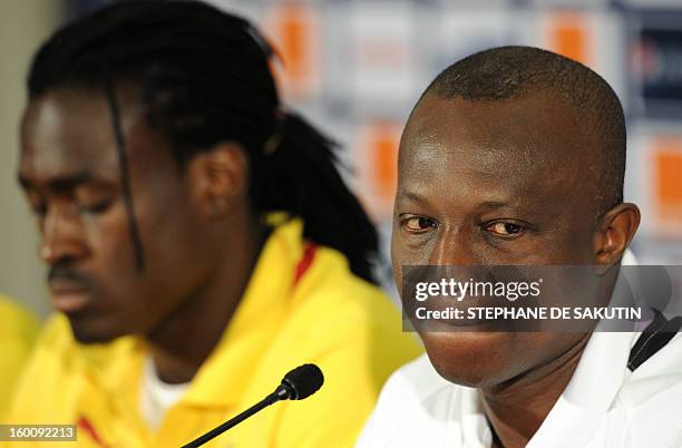 Ghana's national football team head coach Kwesi Appiah , flanked by midfielder Derek Boateng, looks on as he takes part in a press conference at...