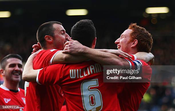 Dean Lewington of Milton Keynes Dons celebrates with team mates after scoring during the FA Cup with Budweiser Fourth Round match between Queens Park...