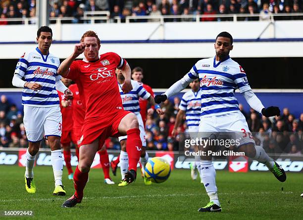 Dean Lewington of Milton Keynes Dons beats Armand Traore of Queens Park Rangers to be ball to score during the FA Cup with Budweiser Fourth Round...
