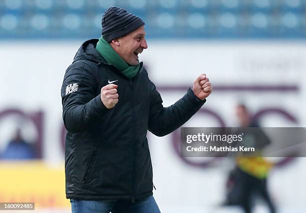 Head coach Pavel Dotchev of Muenster jubilates after his team scoring the second goal during the third league match between FC Hansa Rostock and...