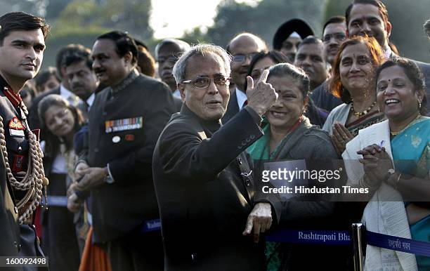 President of India Pranab Mukherjee meets invitees at Rashtrapati Bhavan on Republic Day on January 26, 2013 in New Delhi, India. India marked its...
