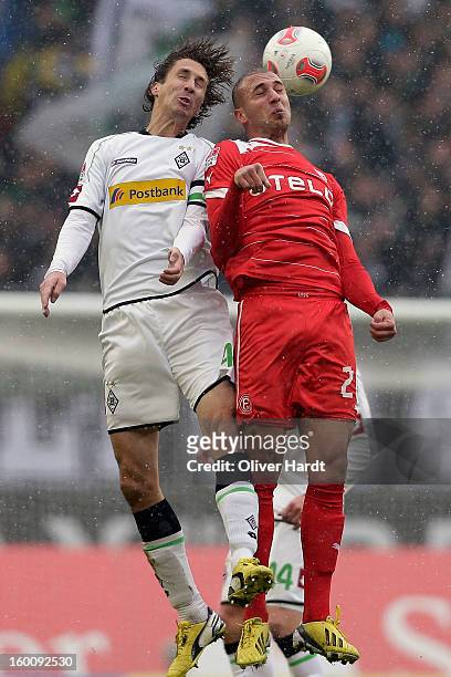 Roel Brouwers of Gladbach and Dani Schahin of Duesseldorf battle for the ball during at Bundesliga match between VfL Borussia Moenchengladbach v...