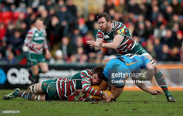 Tom Croft and Brett Deacon of Leicester Tigers tackle Will Taylor of London Wasps during the LV=Cup match between Leicetser Tigers and London Wasps...