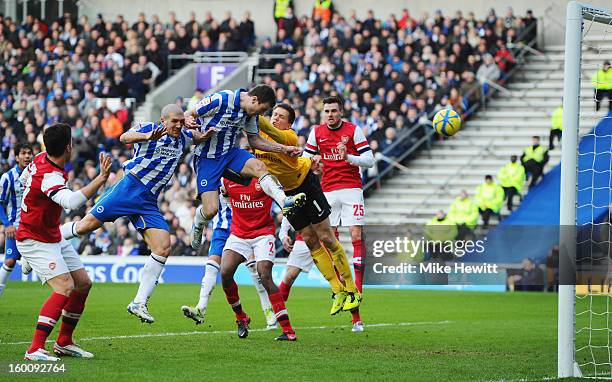 Ashley Barnes of Brighton & Hove Albion beats goalkeeper Wojciech Szczesny of Arsenal to score their first goal during the FA Cup with Budweiser...