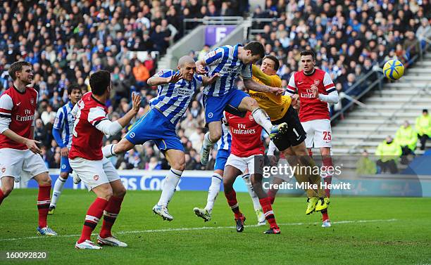 Ashley Barnes of Brighton & Hove Albion beats goalkeeper Wojciech Szczesny of Arsenal to score their first goal during the FA Cup with Budweiser...