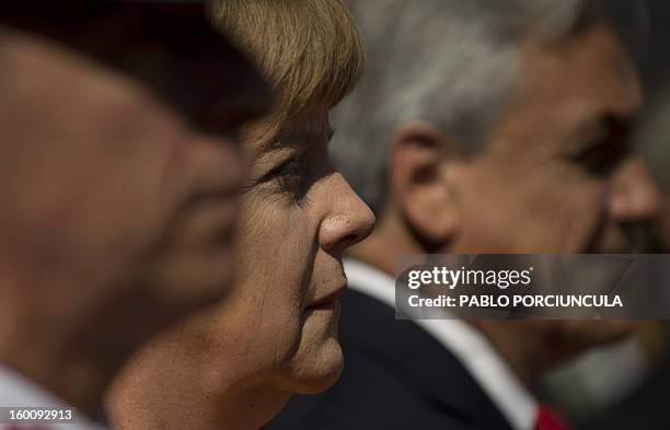 German Chancellor Angela Merkel attends a ceremony upon her arrival at La Moneda presidential palace in Santiago for a meeting with Chilean President...