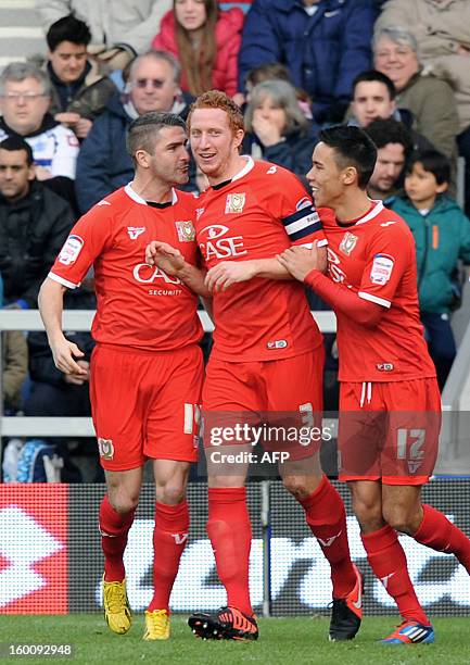 Dons' Dean Lewington celebrates scoring a goal against Queens Park Rangers during the FA Cup fourth round football match between QPR and MK Dons at...