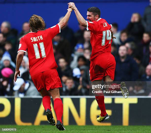 Ryan Lowe of Milton Keynes Dons celebrates with team mate Alan Smith after scoring his sides second goal during the FA Cup with Budweiser Fourth...