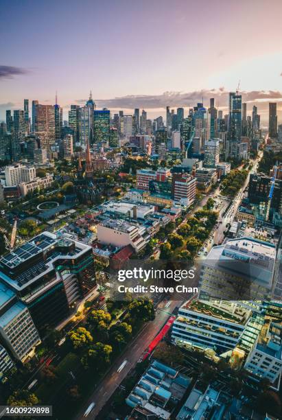 aerial view of melbourne city at dusk - team sport australia stock pictures, royalty-free photos & images
