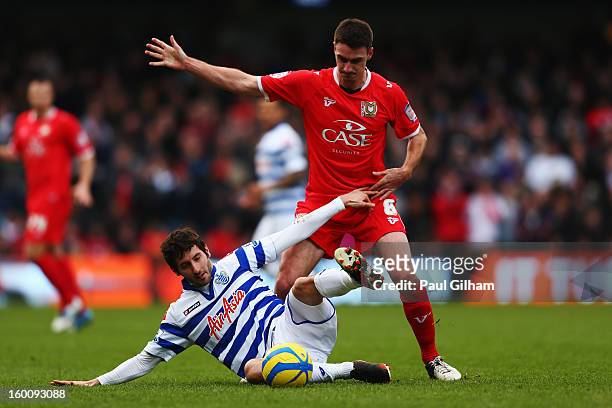 Esteban Granero of Queens Park Rangers holds off the challenge of Darren Potter of Milton Keynes Dons during the FA Cup with Budweiser Fourth Round...