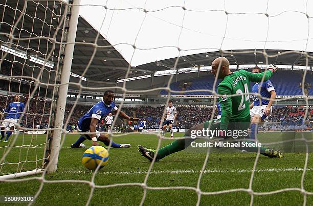 Sylvain Distin and Tim Howard of Everton can only look on as the shot by Marvin Sordell of Bolton Wanderers goes into the back of the net during the...