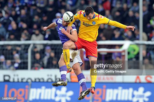 Timo Beermann of Osnabrueck challenges Koen van der Biezen of Karlsruhe during the Third league match between VfL Osnabrueck and Karlsruher SC at...