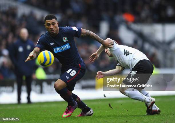 Colin Kazim-Richards of Blackburn Rovers battles with Gareth Roberts of Derby County during the FA Cup with Budweiser Fourth Round match between...